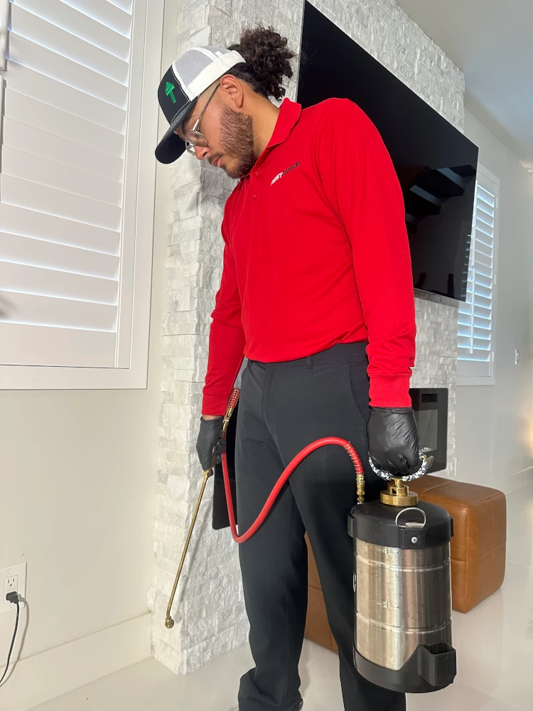 Pest Force pest control technician working on the inside of a Houston home